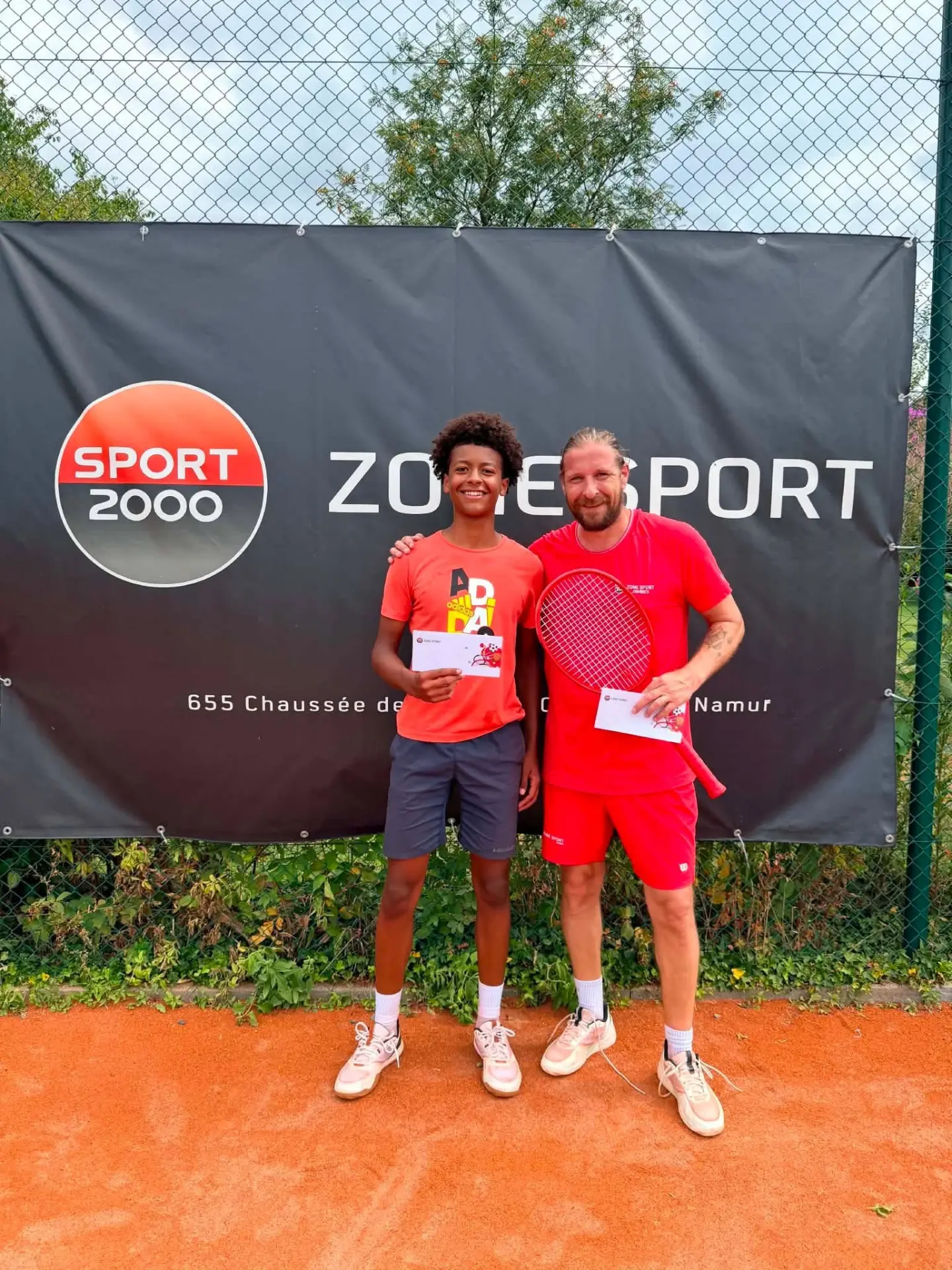 Jeune joueur et son adversaire récompensés au tournoi du TC Godinne